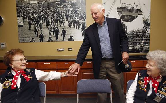 Richmond Mayor Tom Butt walks through the Rosie the Riveter/WWII Home Front National Historical Park Visitor Center next to the five acre controversial Richmond Riviera project in Richmond, California, on Friday, May 20, 2016. He meets with Richmond Kaiser Shipyard #3 journeyman welder Agnes Moore (left), 1942-1945, and Richmond Kaiser Shipyard #3 electrician Priscilla Elder (right), 1943-1945. Developer is planning to build 59 luxury homes seeking support through a ballot measure. Mayor Tom Butt would rather support ideas suited towards the historic past shipyard such as this museum. Photo: Liz Hafalia, The Chronicle