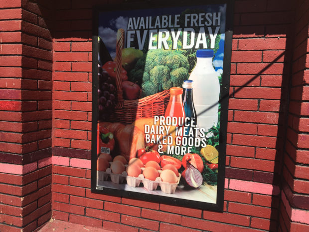 Poster outside Richmond's corner store. Photo by Julia Vassey