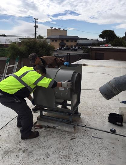 Stationary Engineers replacing exhaust fan in Fire Sta#62