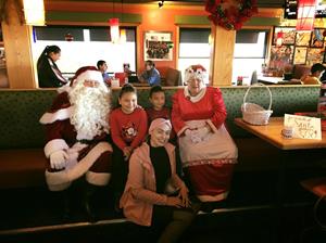 Description: Description: Image may contain: 4 people, people smiling, people sitting and indoor