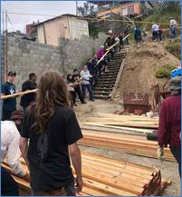 2Teamwork moving lumber