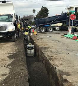 Forde compacting backfill and connecting laterals on Nevin