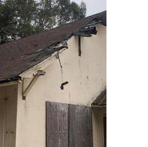 Figure 1 - The former 'Winemaker's Cottage' and later the Navy installation commander's residence has been heavily vandalized and damaged