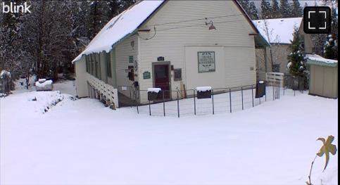 A house with snow on the ground    Description automatically generated